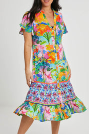 Model Katie wearing size S of the Mirage Dress in colour Print (Blue), from the front, cropped image
