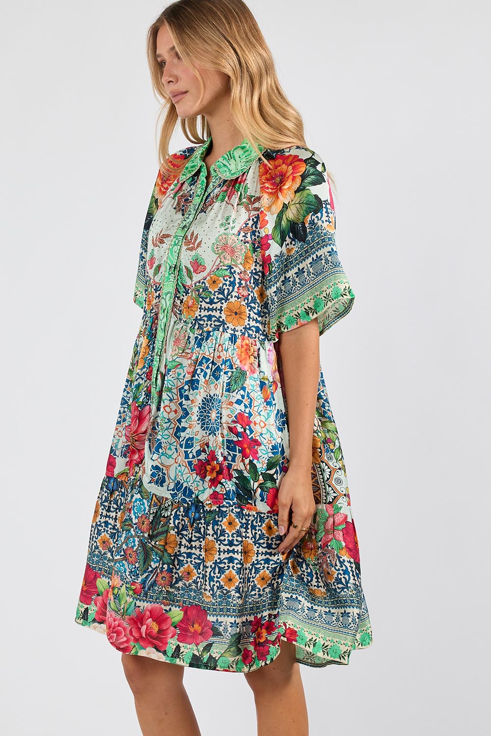 Model Genericm wearing size sample of the Miraval Dress – Mint in colour Mint, from an angle