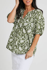 Model Katie wearing size S of the Natura Top in colour Khaki (Green), from the front, cropped image
