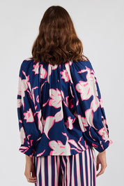 Model Genericm wearing size sample of the Palmilla Floral Top – Navy in colour Navy, from the back