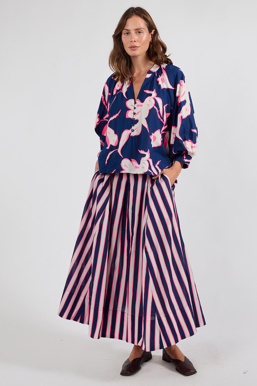 Model Genericm wearing size sample of the Palmilla Floral Top – Navy in colour Navy, from the front