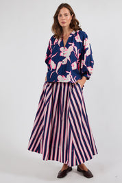 Model Genericm wearing size sample of the Palmilla Floral Top – Navy in colour Navy, from the front