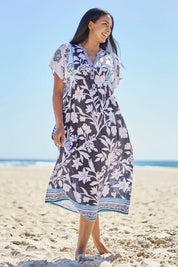Model Eshan wearing size 10 of the Paloma Midi Dress - Print in colour Print, from the front