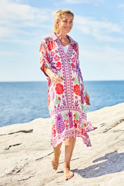 Model Bianca wearing size S of the Parisio Modal Blend Kaftan in colour Fuchsia (Purple), from the front, showing the whole outfit