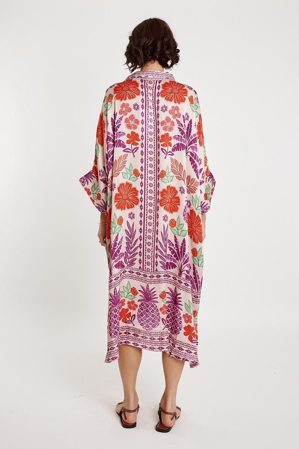 A model wearing the Parisio Modal Blend Kaftan in colour Fuchsia (Purple), from the back