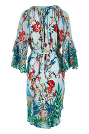 Product shot of the Peacock Dress in colour Mint (Blue), from the back