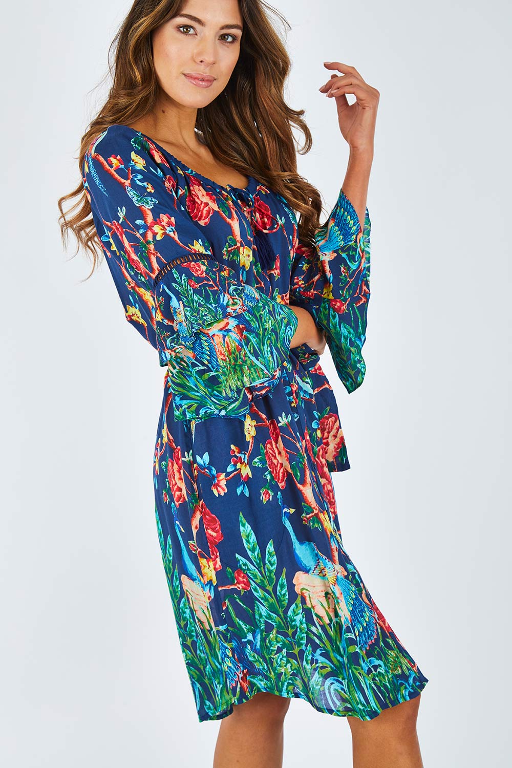 Model Madeline wearing size S of the Peacock Dress in colour Navy (Blue), from the front, cropped image