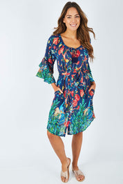 Model Madeline wearing size S of the Peacock Dress in colour Navy (Blue), from the front, showing the whole outfit