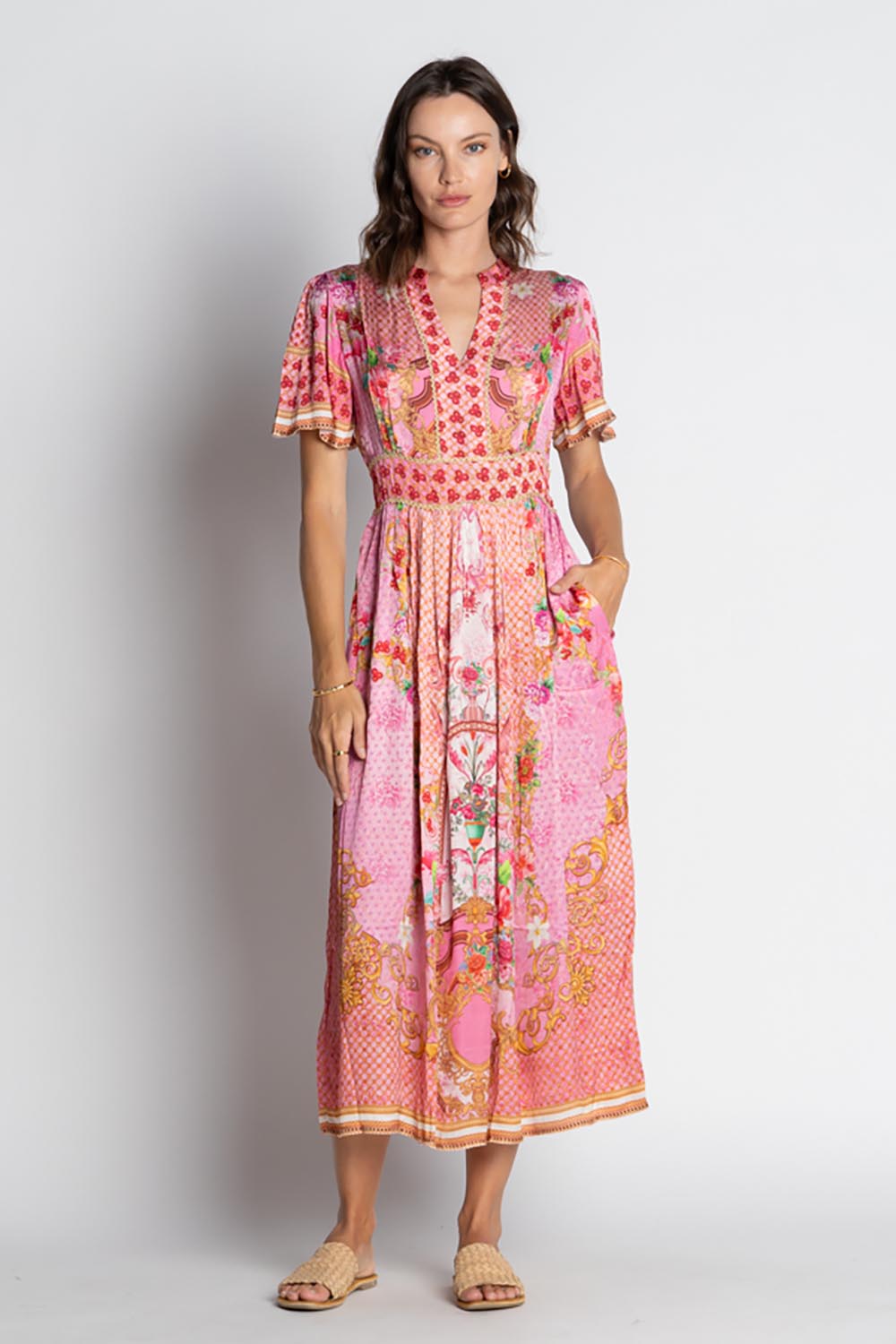 A model wearing the Pellicano Midi in colour Orchid (Pink), from the front, showing the whole outfit