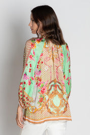 A model wearing the Pellicano Top in colour Mint, from the back