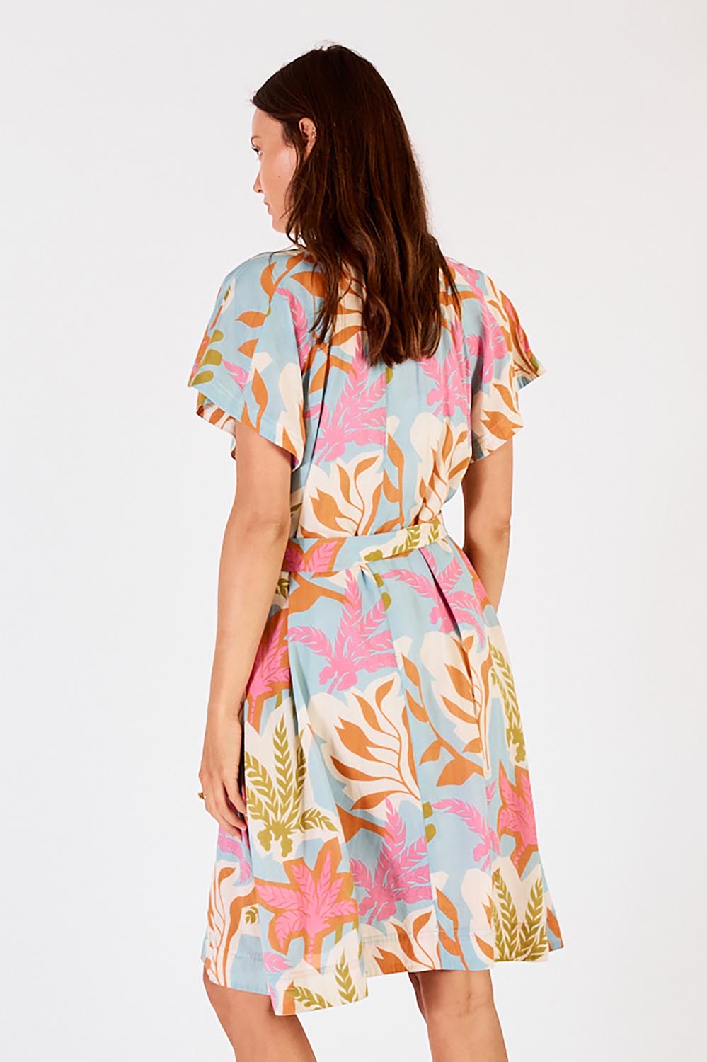 A model wearing the Portabella Dress in colour Cloud (Blue), from the back