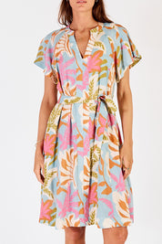 A model wearing the Portabella Dress in colour Cloud (Blue), from the front, cropped image