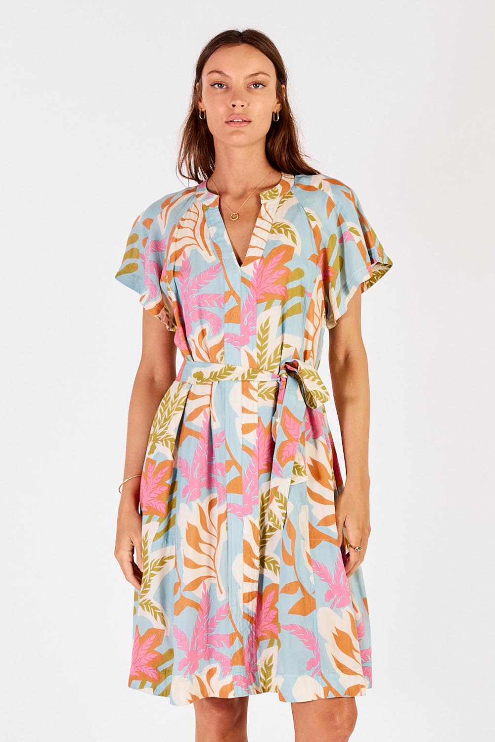 A model wearing the Portabella Dress in colour Cloud (Blue), from the front, cropped image