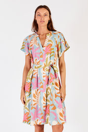 A model wearing the Portabella Dress in colour Cloud (Blue), from the front, cropped image