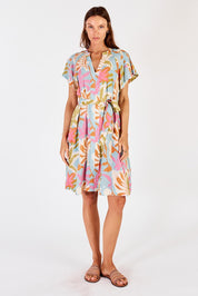 A model wearing the Portabella Dress in colour Cloud (Blue), from the front, showing the whole outfit