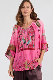 Model Genericm wearing size sample of the Sachiko Top – Fuchsia in colour Fuchsia, in a cropped view