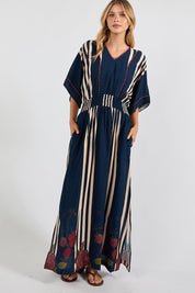 Model Genericm wearing size sample of the Sandos Maxi Dress – Navy in colour Navy, from the front