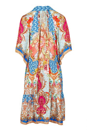 Product shot of the Le Sereno Dress in colour Ocean, from the back