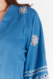 A model wearing the St Luca Cotton Top in colour Ocean (Blue), from the front, cropped image