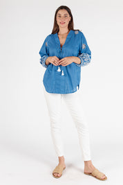 A model wearing the St Luca Cotton Top in colour Ocean (Blue), from the front, showing the whole outfit