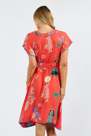 Model Genericm wearing size sample of the Summer Vibes Dress – Melon in colour Melon, from the back