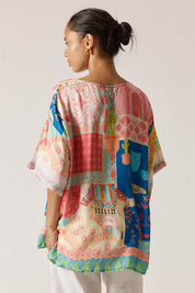A model wearing the Taj Wide Tee in colour Multi, from the back