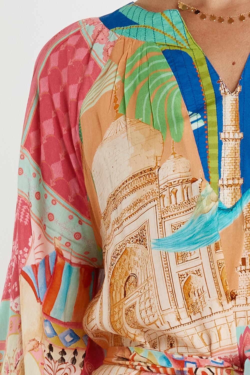 A model wearing the Taj Kaftan in colour Multi, from the front, cropped image