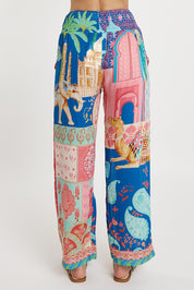 A model wearing the Taj Pant in colour Multi (Blue), from the back