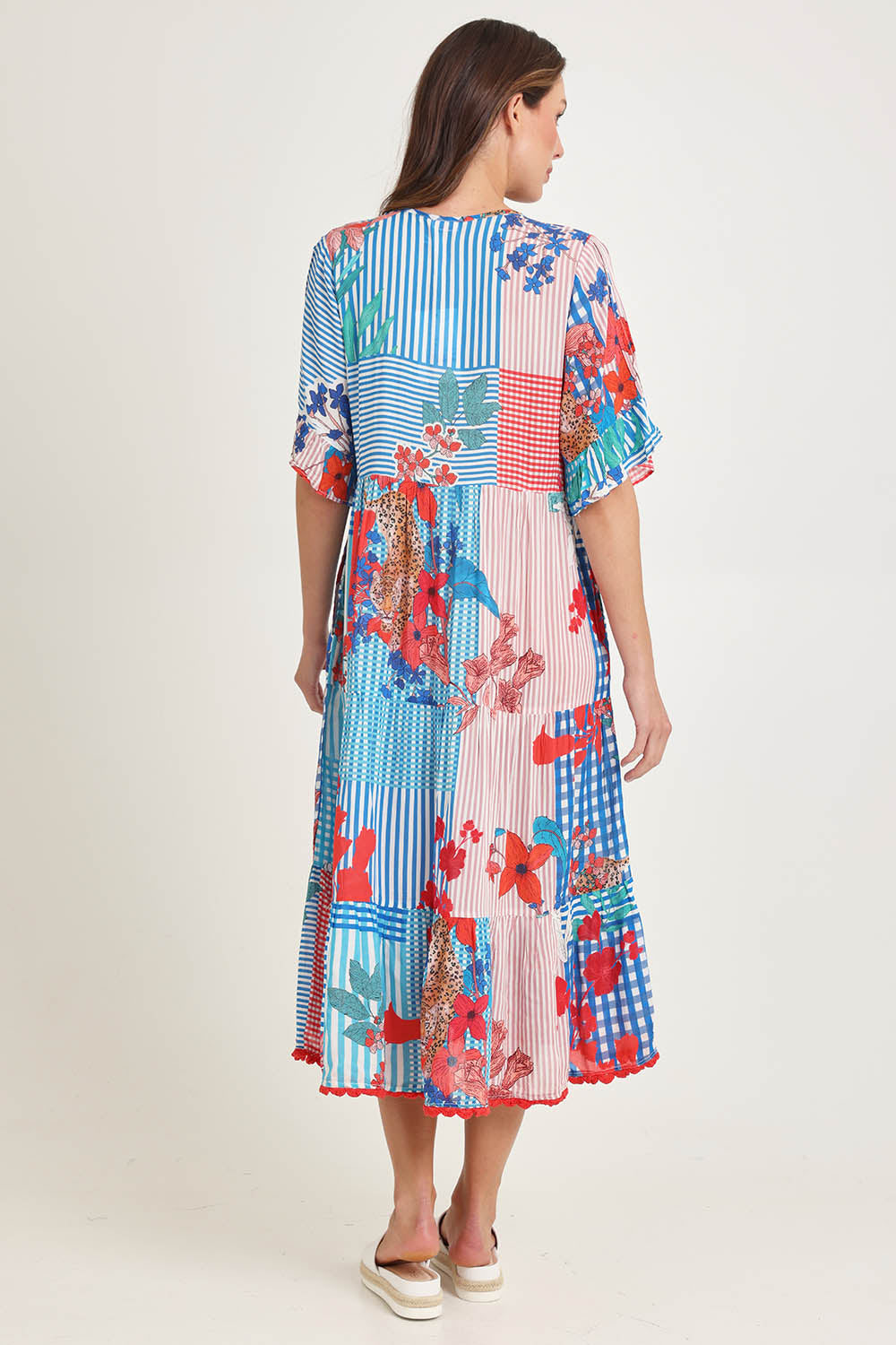 Model Madeline wearing size S of the Wymara Midi Dress in colour Print, from the back