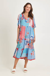 Model Madeline wearing size S of the Wymara Midi Dress in colour Print, from the front, showing the whole outfit