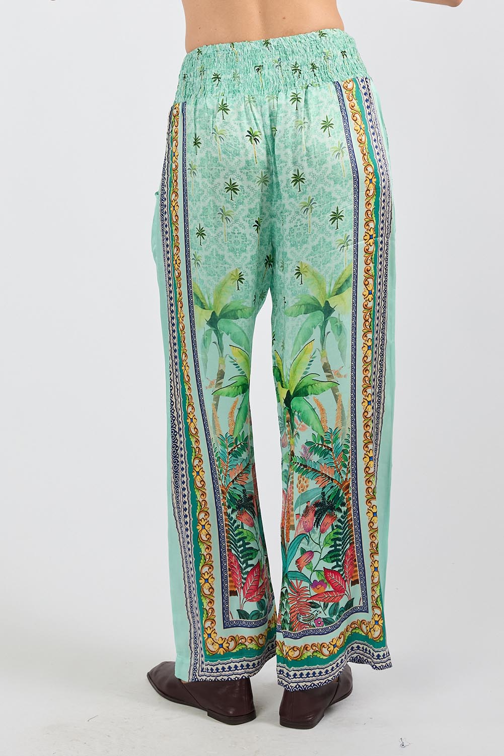 Model Genericm wearing size sample of the Zilara Pant – Mist in colour Mist, from the back