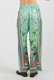 Model Genericm wearing size sample of the Zilara Pant – Mist in colour Mist, from the back