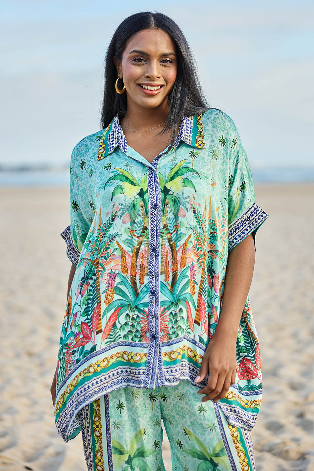 Model Eshan wearing size 10 of the Zilara Kaftan Top – Mist in colour Mist, in a cropped view