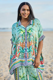 Model Eshan wearing size 10 of the Zilara Kaftan Top – Mist in colour Mist, in a cropped view
