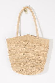A model wearing size OneSize of the Rima Bag in colour Natural, from the front, showing the whole outfit