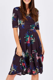 Model Monique wearing size 10 of the City Of Lights Dress in colour Black (Black), from the front, cropped image