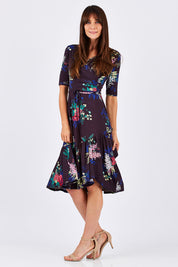 Model Monique wearing size 10 of the City Of Lights Dress in colour Black (Black), from the front, showing the whole outfit