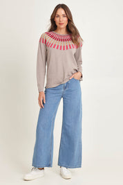 Model Madeline wearing size S of the Josephine Merino Sweater in colour Mushroom, from the front, showing the whole outfit