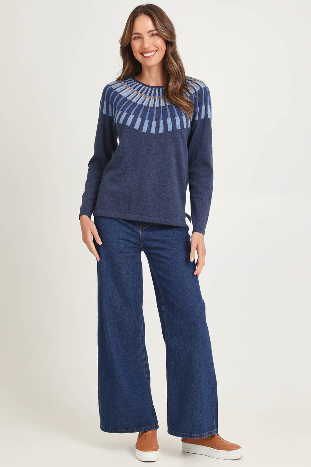 Model Madeline wearing size S of the Josephine Merino Sweater in colour Softblue (Blue), from the front, showing the whole outfit