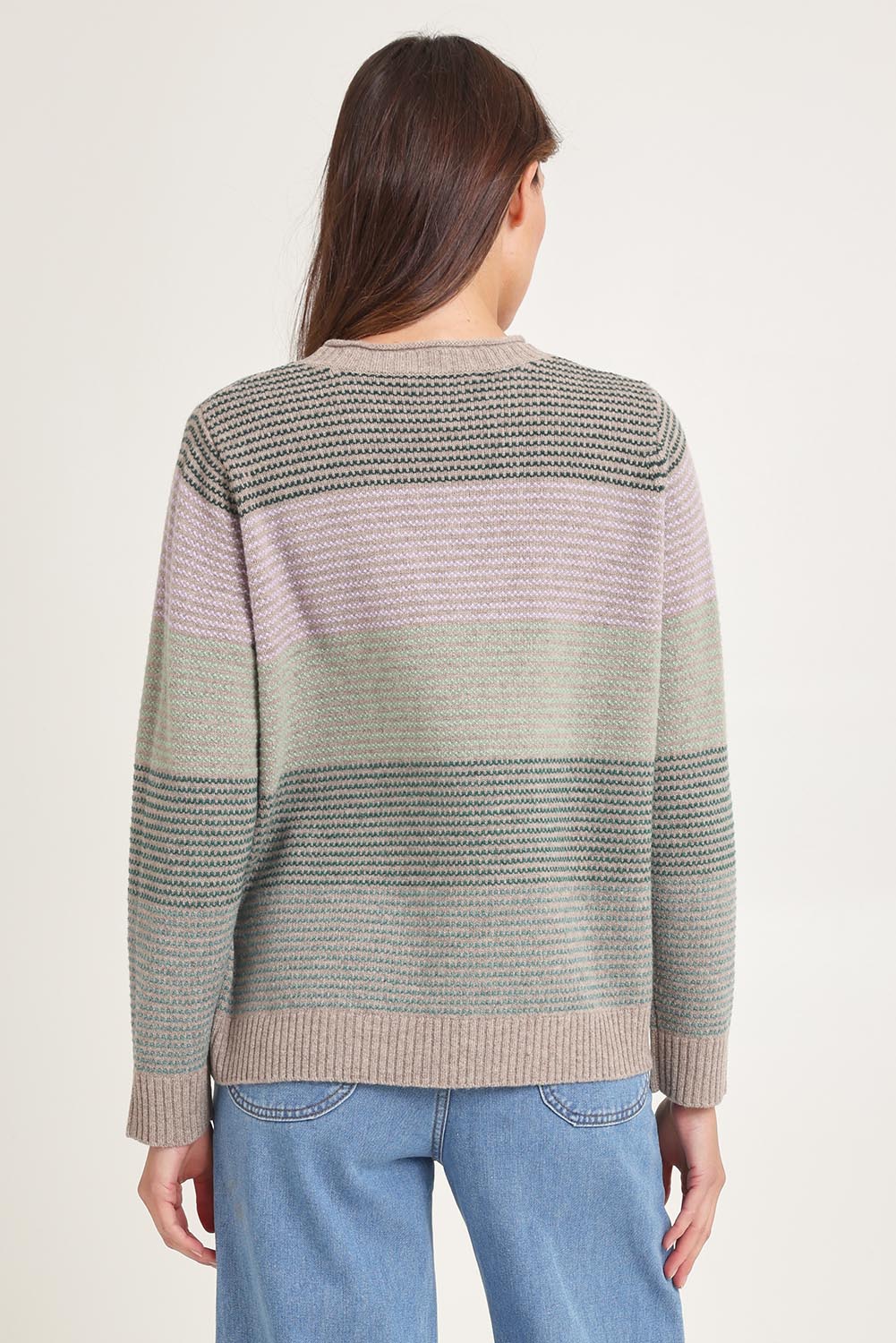 Model Madeline wearing size S of the Louise Lambswool Sweater in colour Mushroom, from the back