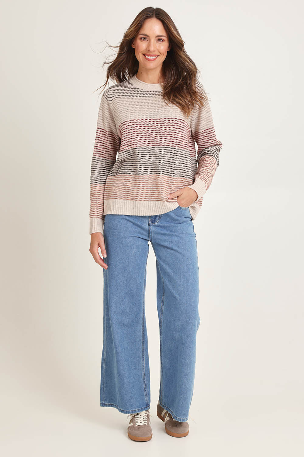 Model Madeline wearing size S of the Louise Lambswool Sweater in colour Oat, from the front, showing the whole outfit
