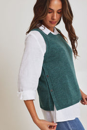 Model Madeline wearing size S of the Mitos Vest in colour Darksea (Green), from the front, cropped image