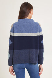 Model Madeline wearing size S of the Popcorn Lambswool Sweater in colour Softblue (Blue), from the back