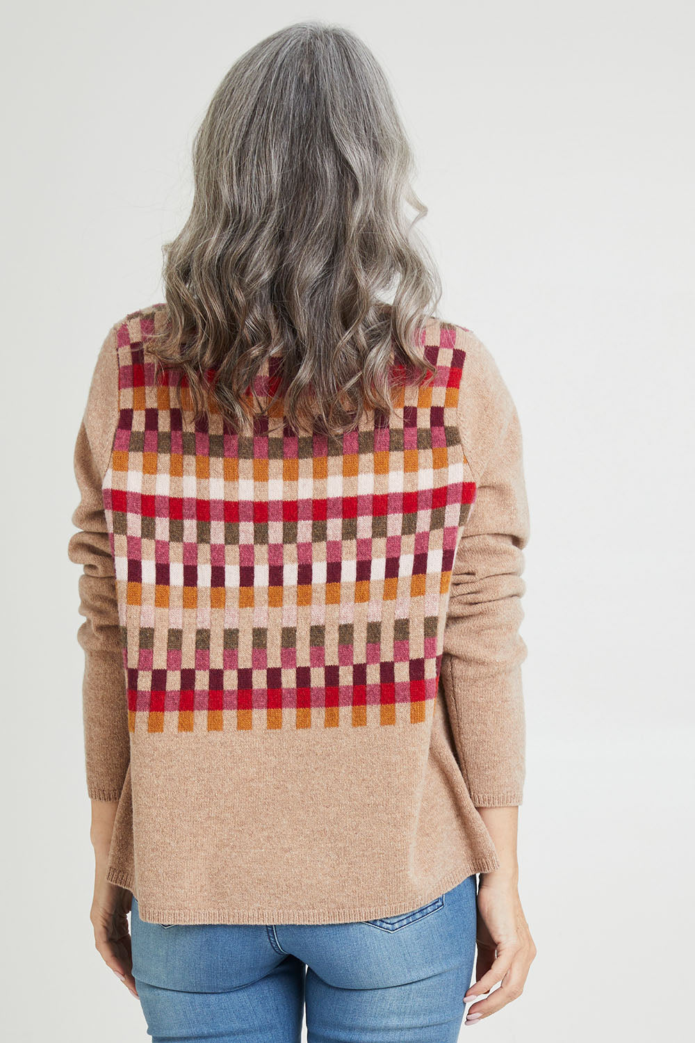 Model Luisa wearing size S of the Salka Sweater in colour Oat, from the back