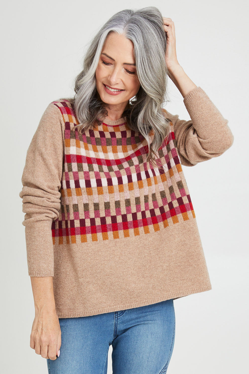 Model Luisa wearing size S of the Salka Sweater in colour Oat, from the front, cropped image