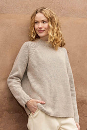 A model wearing the Somers Lambswool Sweater in colour Oat, from the front, showing the whole outfit