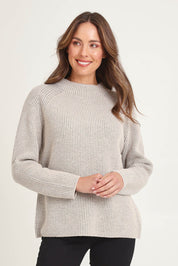 Model Madeline wearing size S of the Somers Lambswool Sweater in colour Oat, from the front, cropped image