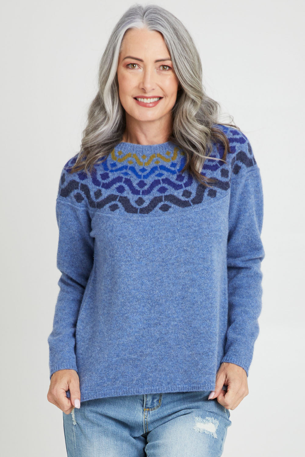 Model Luisa wearing size S of the Vonda Sweater in colour Denim (Blue), from the front, cropped image
