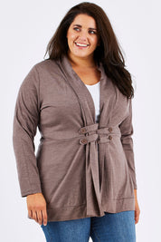 Model Mae wearing size 18 of the Merino Side Button Cardigan in colour Mocha, from the front, cropped image