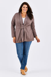 Model Mae wearing size 18 of the Merino Side Button Cardigan in colour Mocha, from the front, showing the whole outfit